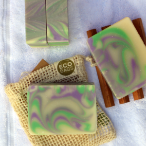 Purple and green soap on a cotton soap pouch