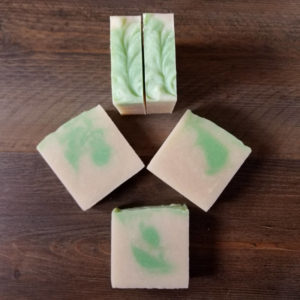 Soap bars arranged on a wood background